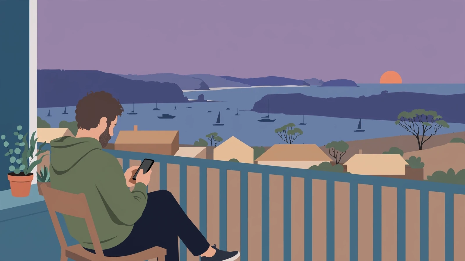 Person on Australian coastal balcony holding a phone at dusk.